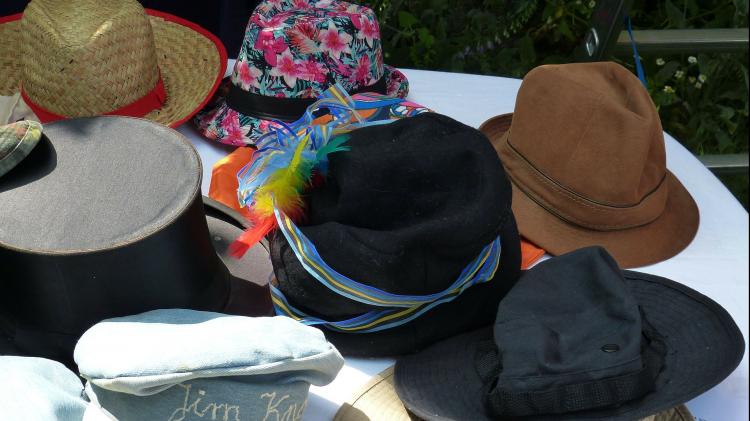 An assortment of hats sitting on a table